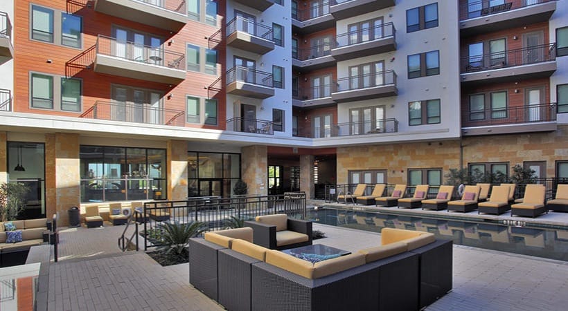 The pool and lounge area of The Kenzie at the Domain.